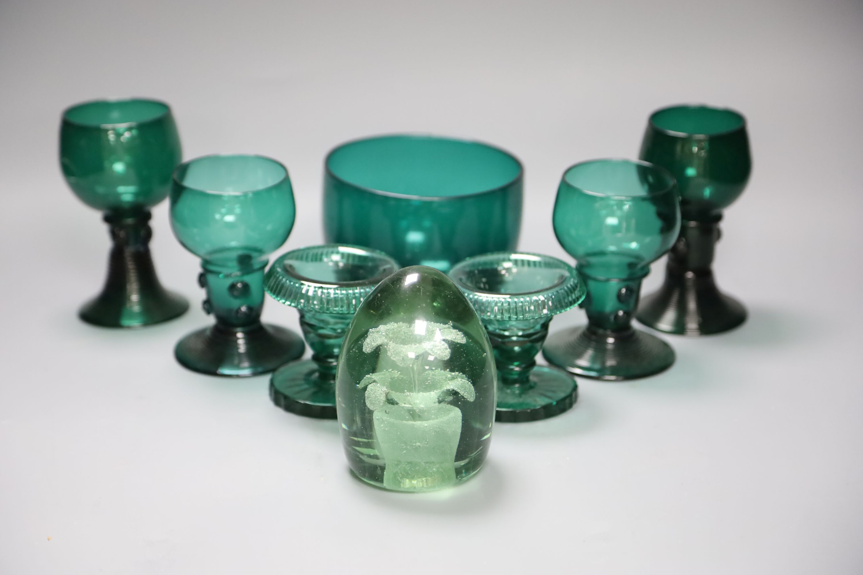 A group of 19th century green glass and a Victorian dump paperweight